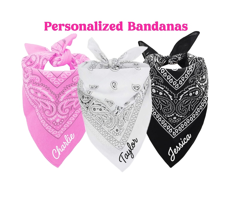 May include: Three personalized bandanas with paisley patterns. The bandanas are pink, white, and black. The names "Charlie", "Taylor", and "Jessica" are written on the bandanas.