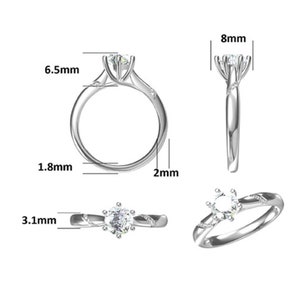 May include: A silver ring with a round, clear gemstone in the center. The ring is 6.5 mm wide and 2 mm thick. The gemstone is 8 mm in diameter.