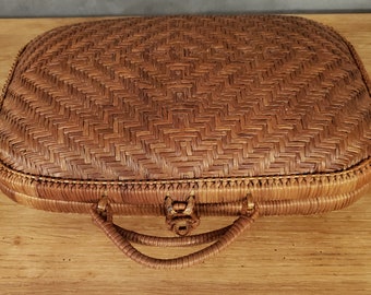 Small woven rattan suitcase