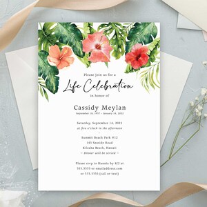 May include: A tropical-themed life celebration invitation with watercolor illustrations of green palm leaves and pink hibiscus flowers. The invitation includes the text "Please join us for a Life Celebration in honor of Cassidy Meylan September 16, 1937 - January 14, 2022 Saturday, September 14, 2023 at five o'clock in the afternoon Summit Beach Park #12 145 Seaside Road Kilraha Beach, Hawaii Dinner will be served Please rsvp to Hannia by 8/2 at 555.5555 or emailaddress.com or 555.5555 (call or text)"