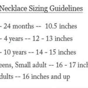 May include: A black text chart titled Necklace Sizing Guidelines listing age ranges and corresponding lengths in inches: 0-24 months at 10.5 inches, 2-4 years at 12-13 inches, 5-10 years at 14-15 inches, teens and small adults at 16-17 inches, and adults at 16 inches and up.