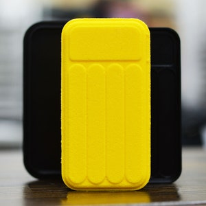 May include: A yellow inflatable pool float with a textured surface and five air chambers. The float is in a black case.