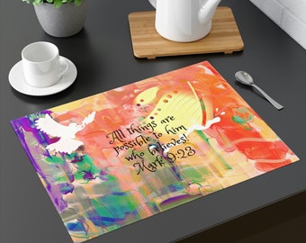 May include: A colorful abstract design placemat with a white dove and a yellow butterfly. The placemat has the text "All things are possible to him who believes! Mark 9:23".