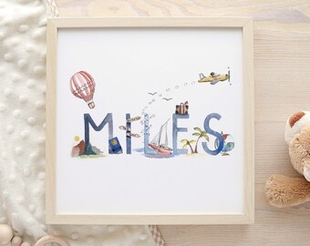 May include: A watercolor print with the name "MILES" spelled out in blue letters. Each letter is decorated with travel-themed illustrations, including a hot air balloon, a lighthouse, a sailboat, palm trees, and an airplane. The print is framed in a light wood frame.