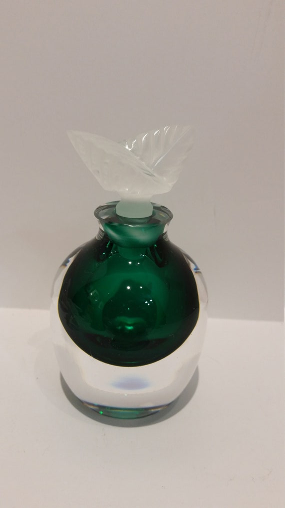 perfume in a green apple shaped bottle