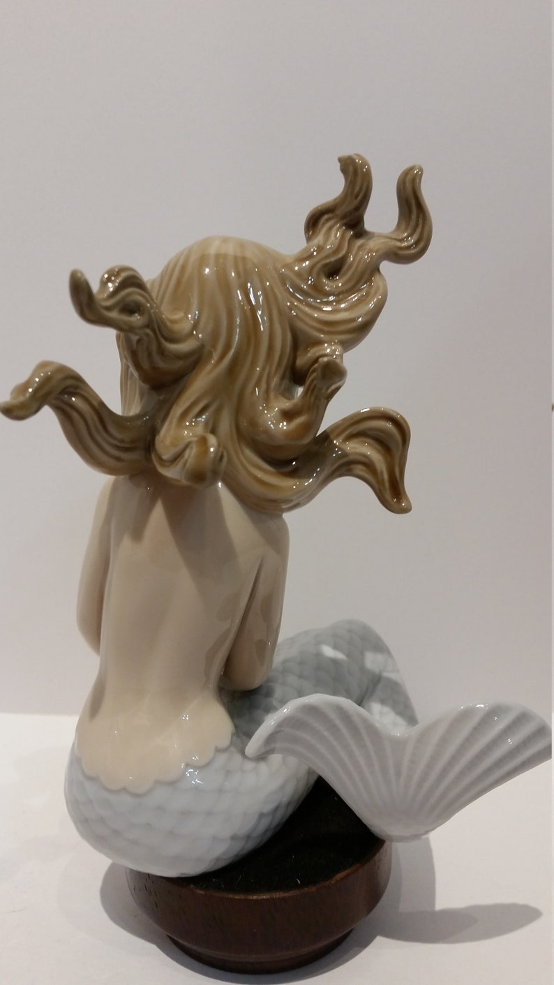 lladro mermaid with shell