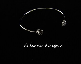 Hibiscus (8mm flowers) Skinny Cuff. Hawaiian & Island inspired jewelry designs. 925 Sterling Silver w/ Rhodium plating to prevent tarnish.