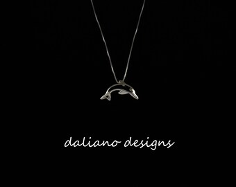 Dolphin 25mmW w/ Marcasite Eye Pendant w/ Chain. Hawaiian inspired jewelry. 925 Sterling Silver w/ Rhodium plating to prevent tarnish.