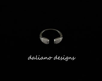 CZ Pave Ring Teardrop Shape 10mmL. Adjustable size 4.5 to 6.5. 925 Sterling Silver w/ Rhodium Plating to prevent tarnish.