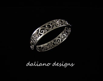 Hibiscus Scroll Bangle 10mmW. Hawaiian & Island inspired jewelry designs. 925 Sterling Silver w/ Rhodium plating to prevent tarnish.