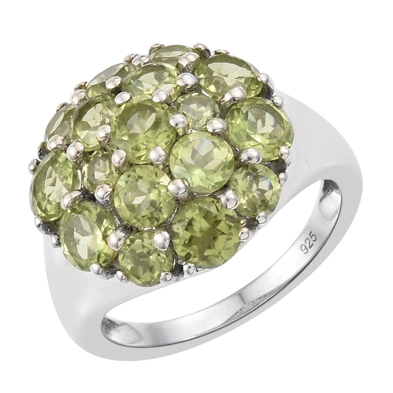 Silver Sterling Green Olivine Ring Holding Peridot Gems And Finished With Rhodium.