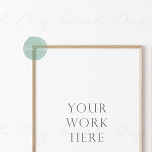 May include: Two wooden picture frames with a white background. The text "YOUR WORK HERE" is written in the center of the frames.