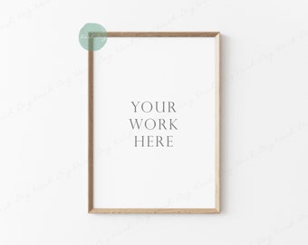 May include: A light wood frame with a white background and the text "YOUR WORK HERE" in the center.