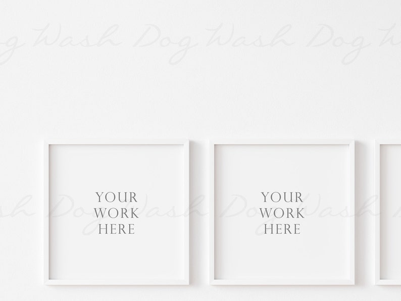 May include: Three white picture frames with white mats, each with the text "YOUR WORK HERE" inside. The frames are hanging on a white wall.