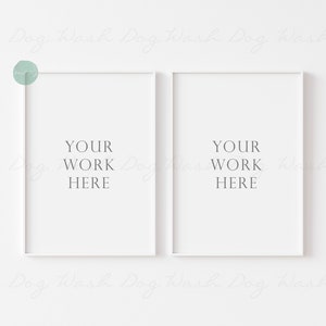 May include: Two white picture frames with a white background. The frames are empty and have the text "YOUR WORK HERE" in each frame.