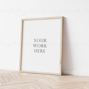 May include: A simple, light wood frame with a white mat and a white background. The text "YOUR WORK HERE" is printed in black on the white background.