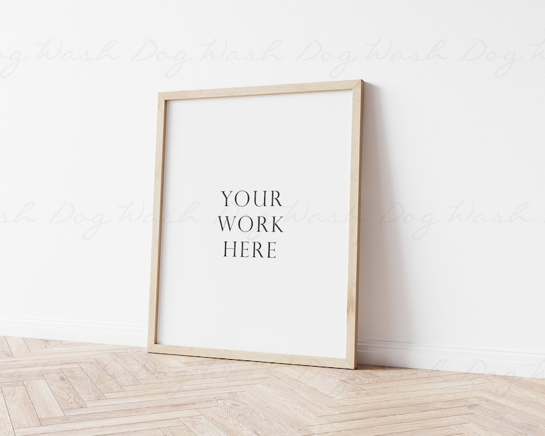 May include: A simple, light wood frame with a white mat and a white background. The text "YOUR WORK HERE" is printed in black on the white background.