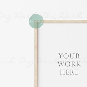 May include: A white frame with a wooden border, sitting on a white background. The text "YOUR WORK HERE" is printed in the center of the frame.