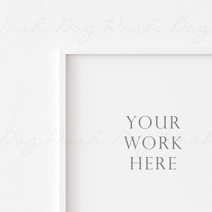 May include: A white picture frame with the text "YOUR WORK HERE" in a serif font. The frame is set against a white background. The image is a mockup for displaying artwork or photography.