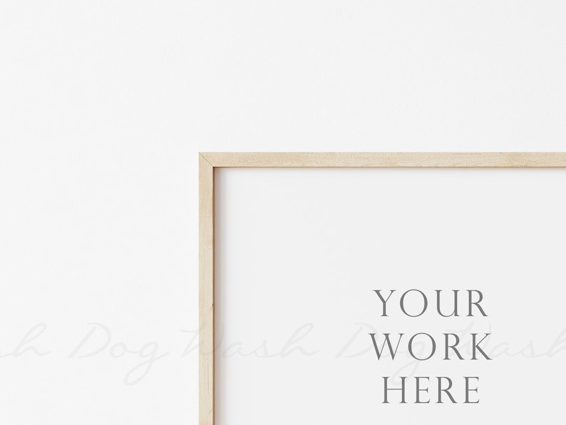 May include: A simple wooden frame with a white background and the text "YOUR WORK HERE" in the center.