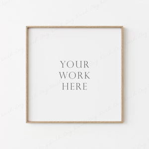 May include: A simple, light wood frame with a white background. The text "YOUR WORK HERE" is printed in the center of the frame.