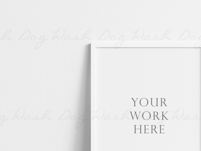 以下が含まれることがあります： 白いフレームのモックアップで、白い背景にグレーのテキスト「YOUR WORK HERE」が表示されています。