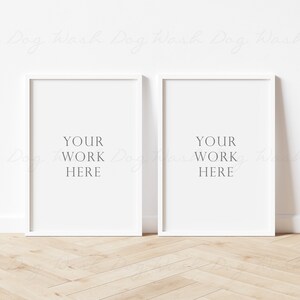 May include: Two white picture frames with a white mat and a white background. The frames are hanging on a white wall. The text "YOUR WORK HERE" is printed in the center of each frame.