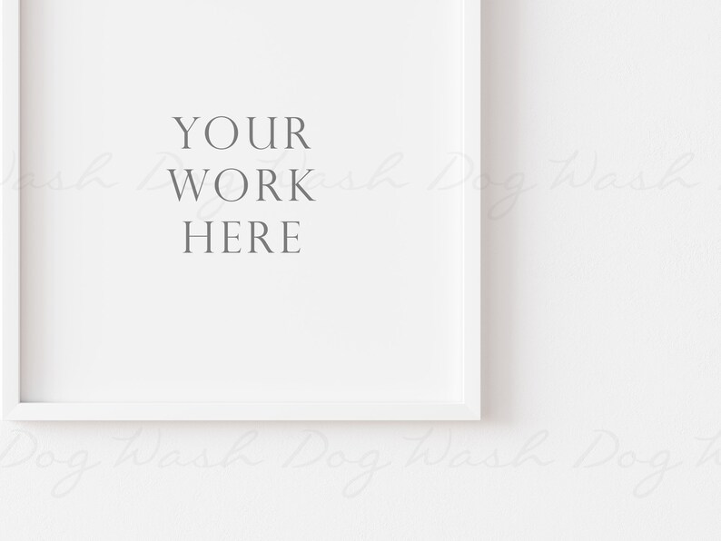 May include: A white square picture frame with the text "YOUR WORK HERE" in gray. The frame is set against a white background, creating a clean and minimalist aesthetic. Ideal for showcasing artwork or photography.