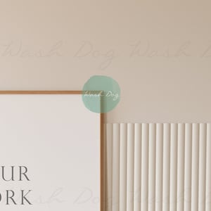 May include: A framed poster with the text "YOUR WORK" in a minimalist style. The poster is hanging on a wall with a light beige background and a white vertical slat wall.
