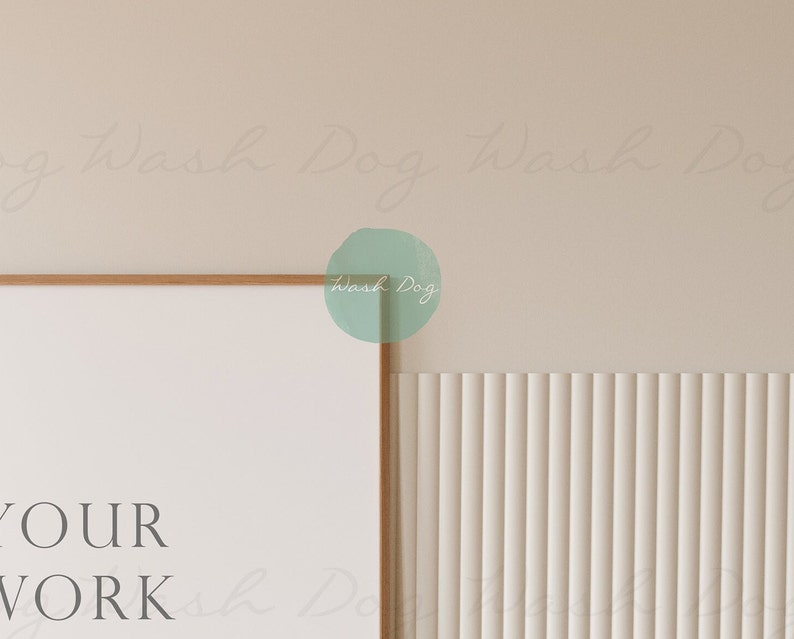 May include: A framed poster with the text "YOUR WORK" in a minimalist style. The poster is hanging on a wall with a light beige background and a white vertical slat wall.