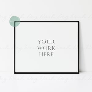 Könnte beinhalten: Ein schwarzer Bilderrahmen mit einem weißen Passepartout und dem Text "YOUR WORK HERE" in der Mitte.