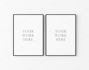 Könnte beinhalten: Zwei schwarze gerahmte Poster mit weißen Hintergründen und dem Text "Your Work Here" in der Mitte jedes Posters.