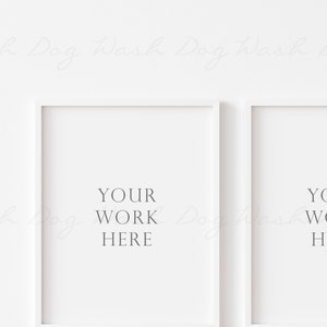 May include: Two white picture frames with a white background. The text "YOUR WORK HERE" is printed in gray inside each frame.
