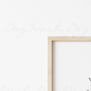 May include: A framed print with the text "You are the sunshine that makes my world go round" in a light gray font on a white background. The frame is made of light wood.