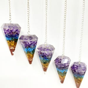 May include: A set of three ceramic mugs with a speckled, matte finish. The mugs are in shades of cream, light gray, and dark gray. Each mug has a simple, minimalist design, perfect for coffee or tea.