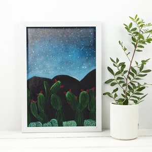 May include: A framed illustration of a desert landscape at night with a starry sky and a cluster of cacti in the foreground.