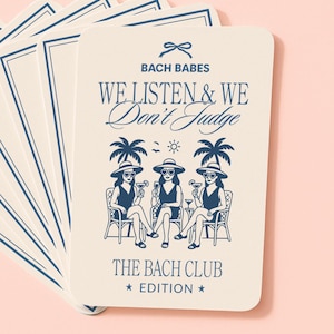 Puede incluir: Un montón de tarjetas blanquecinas con borde azul marino y texto. La tarjeta frontal presenta las palabras "Bach Babes We Listen & We Don't Judge" sobre una ilustración de tres mujeres. El texto "The Bach Club Edition" está debajo.