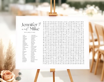 May include: A white rectangular wedding sign on a wooden easel featuring the text Jennifer and Mike Sip and Find, a word search puzzle, and a list of words including Love, Wedding, Vows, Marriage, Forever, Soulmate, and Cherish.
