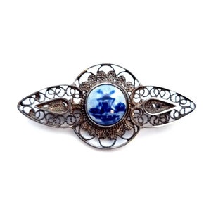 Filigree silver brooch. Netherlands mill brooch. Circa 1960. Antique and antique jewels.