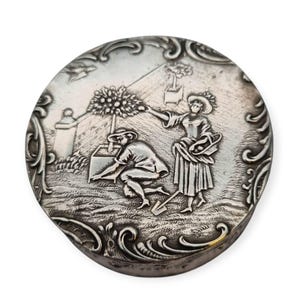 Antique German 800 silver round box with a bucolic garden scene and the German hallmark &quot;crescent moon and crown&quot;, gifts for collectors.