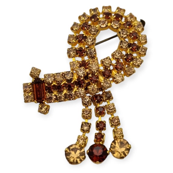Vintage art deco brooch for women, cascading rhinestone cluster in brown, 1960s, shiny retro gifts, antique and vintage jewelry.