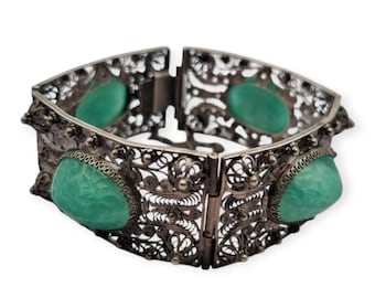Antique Art Deco Chinese export bracelet of silver filigree and green pressed glass cabochons, circa 1920-30, oriental jewelry.
