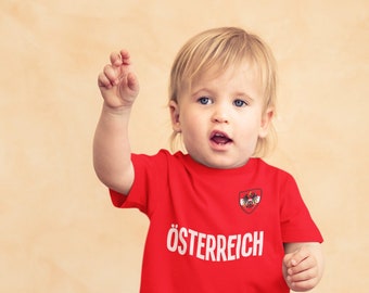 BABY oder Kinder OSTERREICH Austria Fußball T-Shirt, Name & Fahne Brustabzeichen Bio-Baumwolle, Jungen Mädchen Nachhaltiges Geschenk