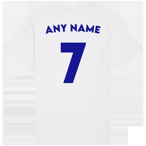 May include: White t-shirt with a blue number 7 and the text "ANY NAME" on the back.
