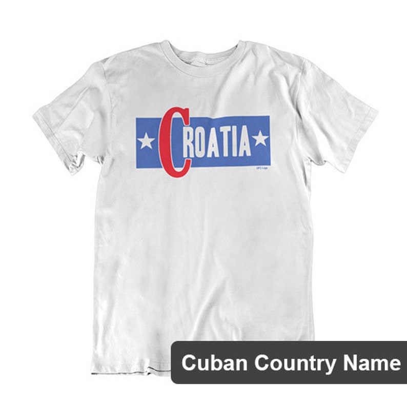 May include: White t-shirt with a blue and red graphic that says "CROATIA" with stars on either side.
