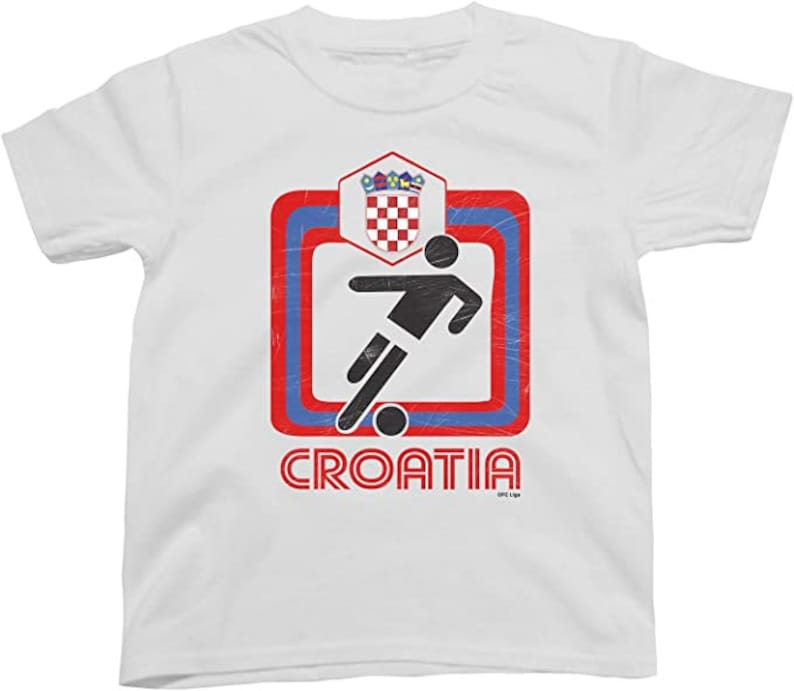 May include: White t-shirt with a red, blue, and white graphic of a soccer player kicking a ball. The graphic is surrounded by a red, blue, and white border. The text "CROATIA" is printed below the graphic.