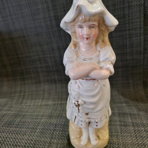 Antique German Bisque Porcelain Girl Figurine, Victorian Fairing Bonnet Statue, Vintage White and Gold Ceramic Spill Holder Mantle Decor