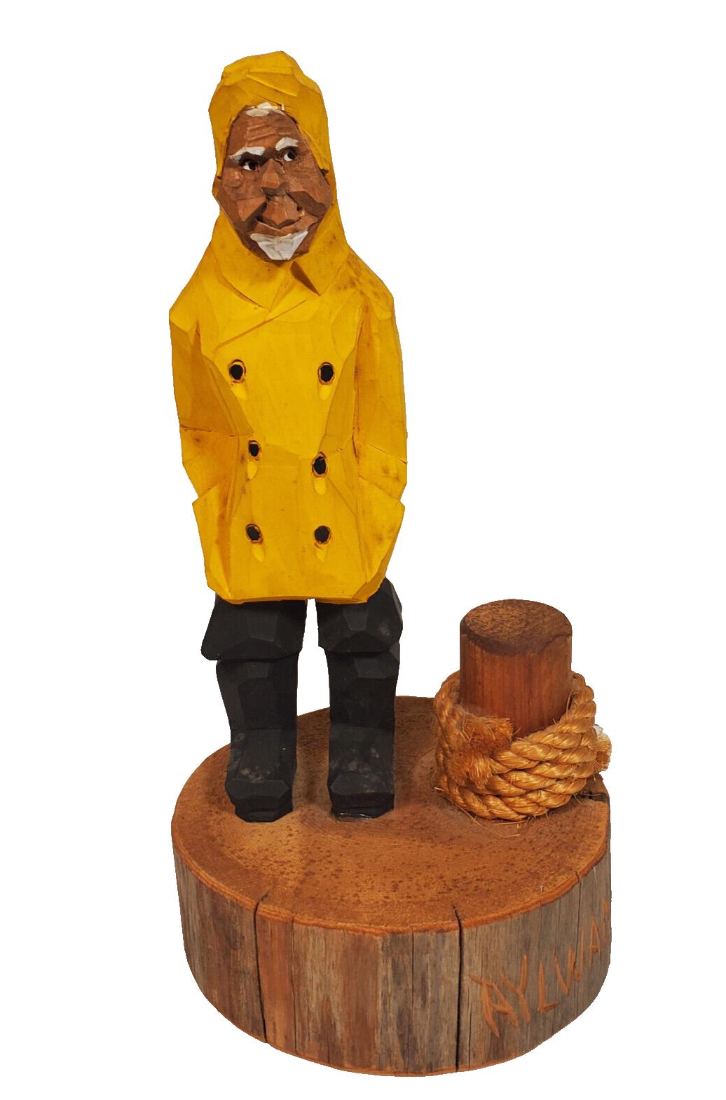 Fisherman in yellow raincoat statue deals