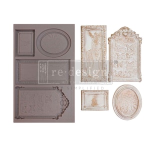 May include: A silicone mould with six different frame designs. The mould is brown and the frames are white with a distressed finish. The frames feature butterflies, a zebra, and a rabbit.