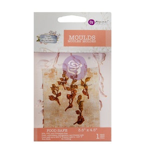 May include: Package of food-safe molds with a botanical theme. The package features the words "MOULDS" and "MOULES MOLDES" in a peach color. The molds are 3.5" x 4.5" and are non-stick. The package also includes the text "the plant department".